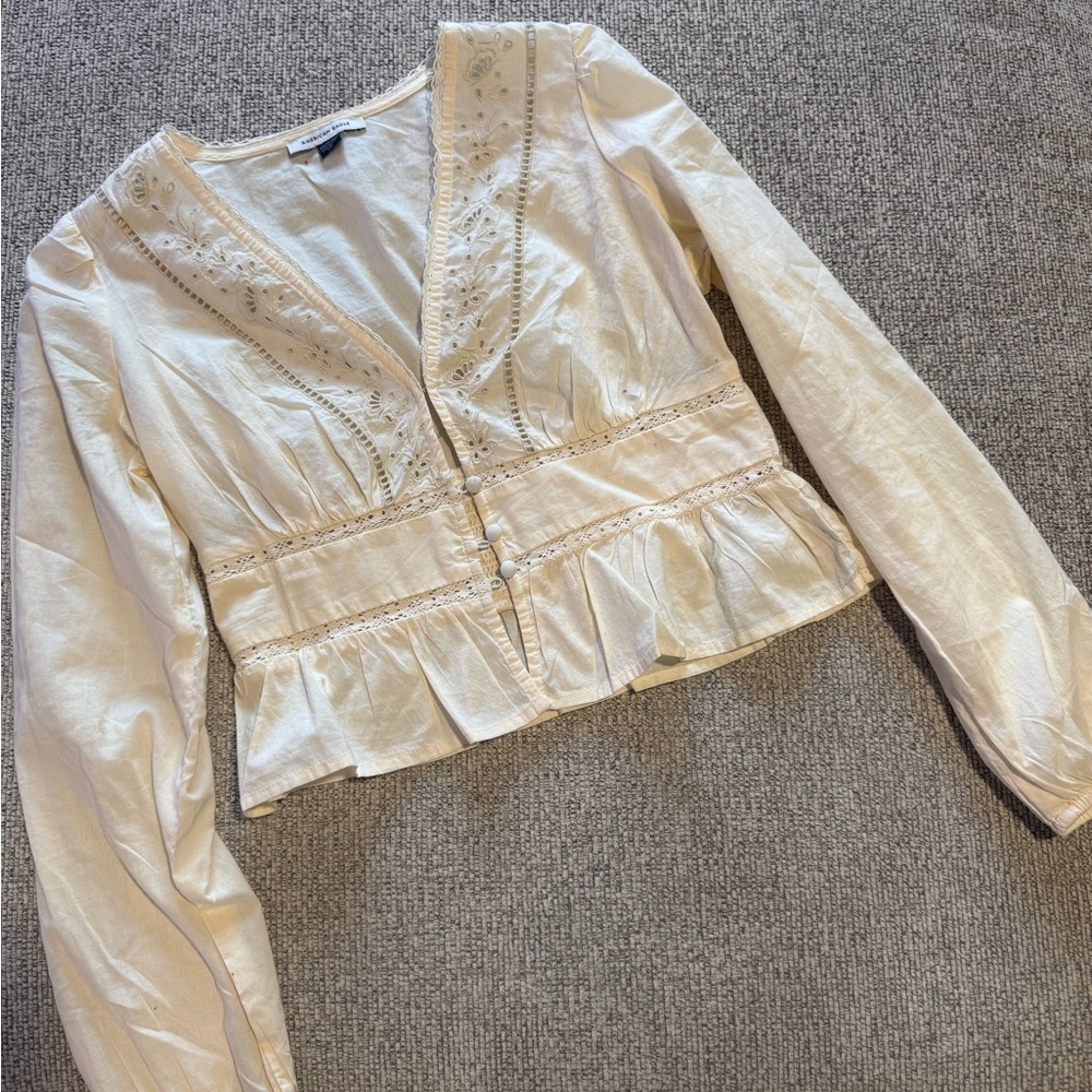 American Eagle top is ivory/cream.